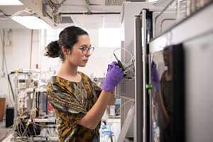 Caltech graduate student Hannah Dion- Kirschner studies microbes—tiny organisms that can typically only be seen under a microscope—in soil that eat methane, a powerful greenhouse gas.