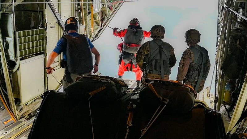 Members of the California Air National Guard, jump.