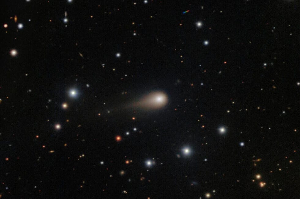 a comet streaking across a star field